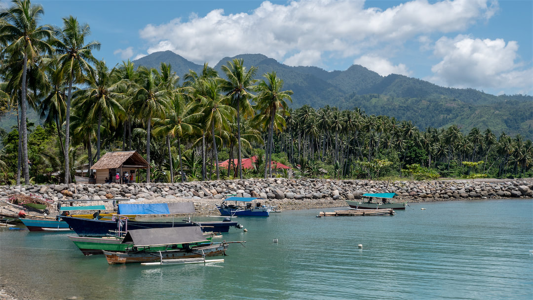 Small harbour in Bolsel, in the background the mountains